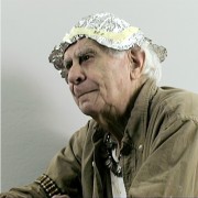 Older man wearing aluminum foil on his head